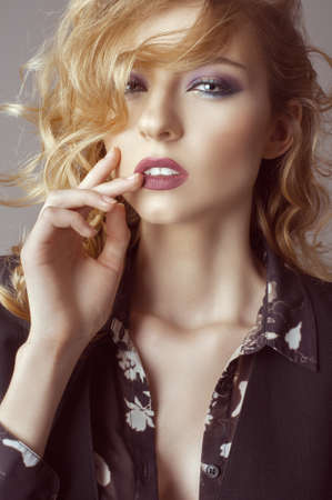 portert curly young girl with beautiful make-upの写真素材