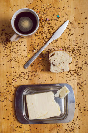 Still life of pastries coffe and butter knifeの写真素材