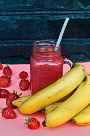 Delicious smoothies with strawberries and banana. Bright summer colorsの写真素材