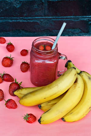 Delicious smoothies with strawberries and banana. Bright summer colorsの写真素材