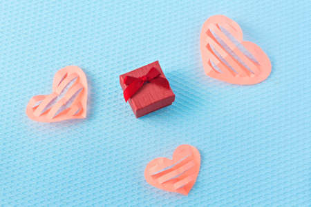 Hearts and ring on a blue background. Valentine's Day. Valentines day greeting card. An offer of...