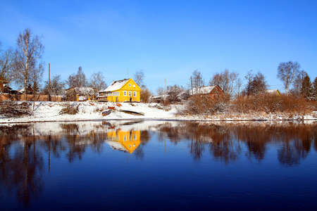 reflection yellow house in riverの写真素材
