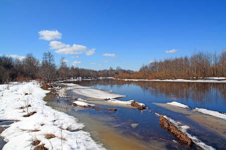 autumn ice on small riverの写真素材