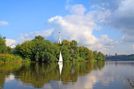 small sailboats on riverの写真素材