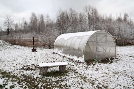 plastic hothouse in winter gardenの写真素材