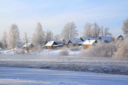winter village on coast riverの写真素材