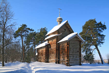 wooden chapel in winter woodの写真素材