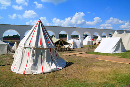 white tents near ancient wallの写真素材