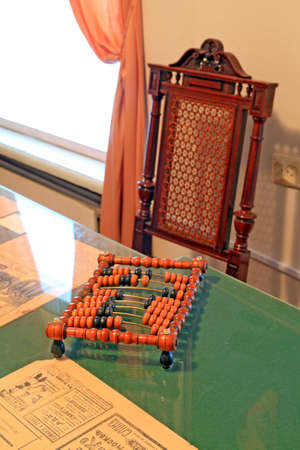 wooden abacus on green table