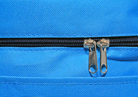 metallic zipper on blue fabricsの写真素材