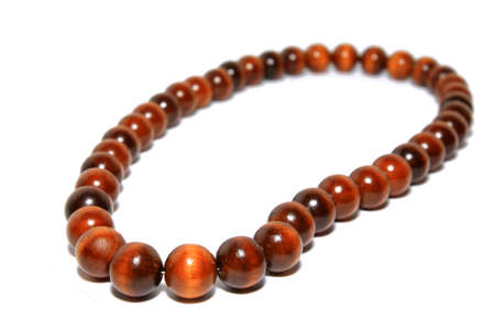 wooden necklace on white backgroundの写真素材