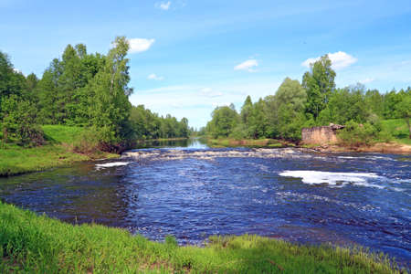 river flow on old destroyed damの写真素材