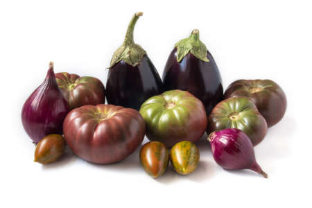 Organic vegetables - tomatoes, eggplants, and onions, isolated on whiteの写真素材