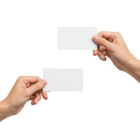 Hands holding cards, isolated on white backgroundの素材