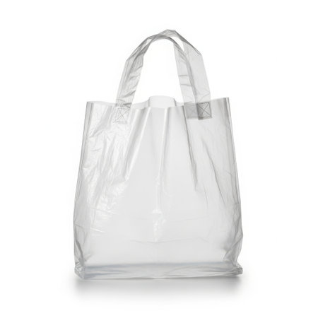 Clear plastic shopping bag isolated on white backgroundの素材