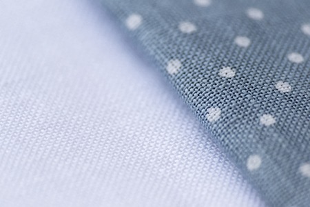 White and polka dot canvas texture for background. macro.