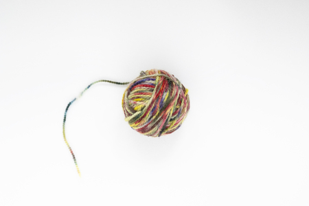 Multicolor ball of yarn on a light background. Close-up. Copy space.の写真素材