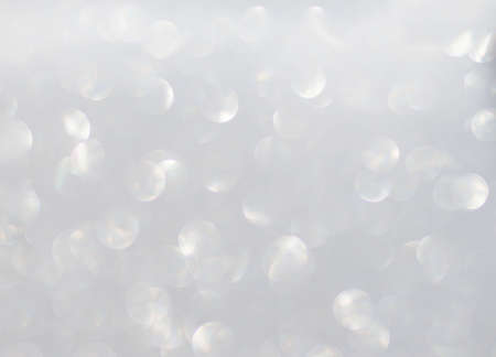 Defocused silver background. Abstract blurred bokeh light.の写真素材