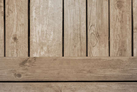 Light wooden background close-up. Vertical and horizontal arrangement of boardsの写真素材