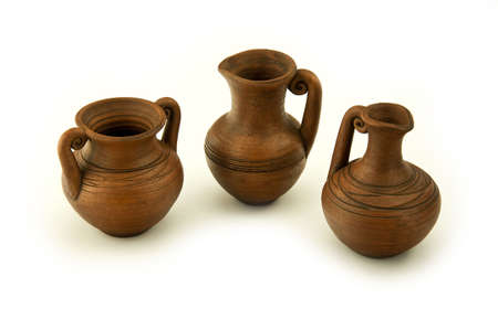 three ceramic wine pitchers isolated on a white backgroundの写真素材