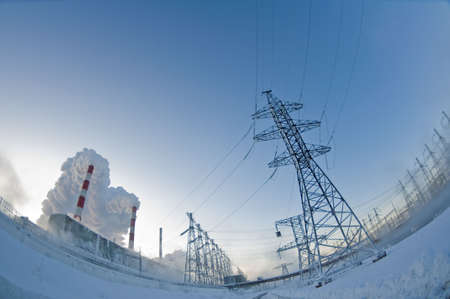 power plant and high-voltage cable line on a winter blue sky  backgroundの写真素材