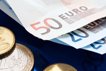 Euro Banknotes and coins closeup. selective focus.の写真素材