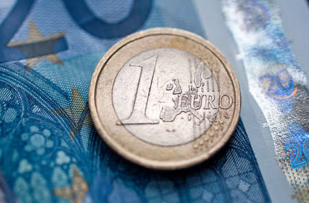 one euro coin and banknotes  closeup. selective focus.の写真素材