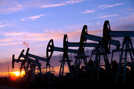 oil pumps on the sunset sky background の写真素材