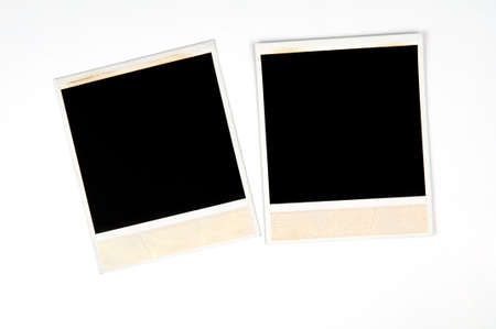 two old photo frames on a white backgroundの写真素材