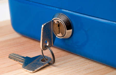 blue cash money box and two key. closeup.の写真素材