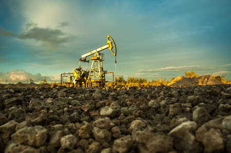 Oil pump jacks at sunset sky background.の写真素材