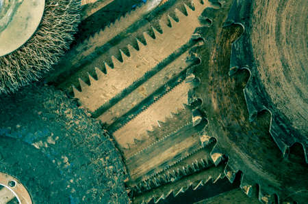 Closeup various hacksaw, circular saw blades and abrasive disks pattern.