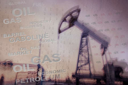 Work of oil pump jack on a oil field and finance analytics background. Textured concrete grunge,...