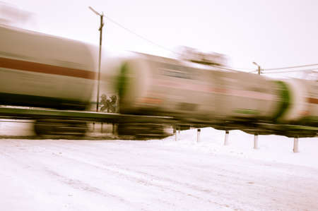 Train with oil tanks moving. Transportation of fuel on the railroad. Motion blur.の写真素材
