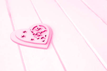 Pink heart on a white wood background.の写真素材