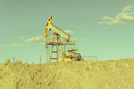 Oil pumpjack, industrial equipment. Extraction of oil. Petroleum concept.の写真素材