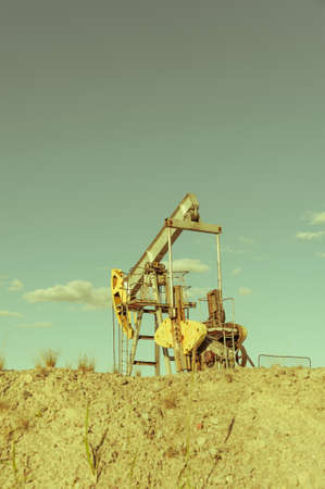 Oil pumpjack, industrial equipment. Extraction of oil. Petroleum concept.の写真素材