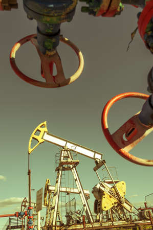 Oil pumpjack, industrial equipment. Extraction of oil. Petroleum concept.の写真素材