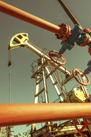 Oil pumpjack, industrial equipment. Extraction of oil. Petroleum concept.の写真素材