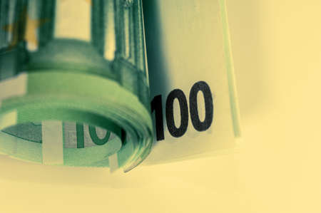 Euro money, Euro cash background. Banknotes of the european union on a white background. Close up. 100 euros roll.の写真素材