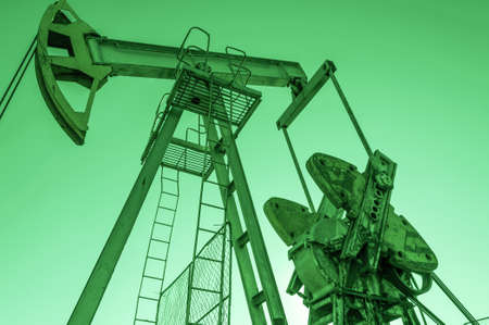 Oil pumpjack, industrial equipment. Rocking machines for power genertion. Extraction of oil. Petroleum concept.の写真素材