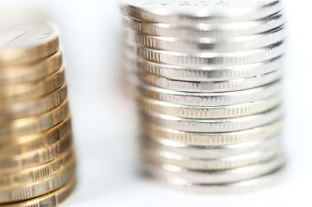 Stack of coins macro. Rows of coins for finance and banking concept. Economy trends background for business idea.の写真素材