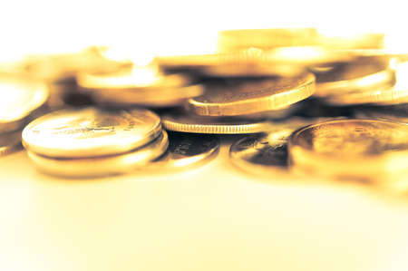 Stack of golden coins macro. Rows of coins for finance and banking concept. Economy trends background for business idea.の写真素材