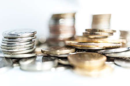 Stack of coins macro. Rows of coins for finance and banking concept. Economy trends background.の写真素材