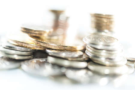 Stack of coins macro. Rows of coins for finance and banking concept. Economy trends background.の写真素材