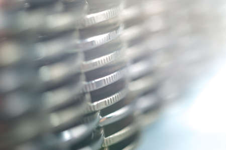 Stack of coins macro. Rows of coins for finance and banking concept. Economy trends background.の写真素材