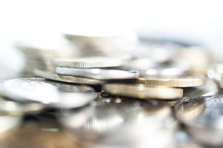 Stack of coins macro. Rows of coins for finance and banking concept. Economy trends background.の写真素材