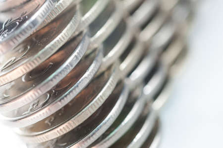Stack of coins macro. Rows of coins for finance and banking concept. Economy trends background.の写真素材