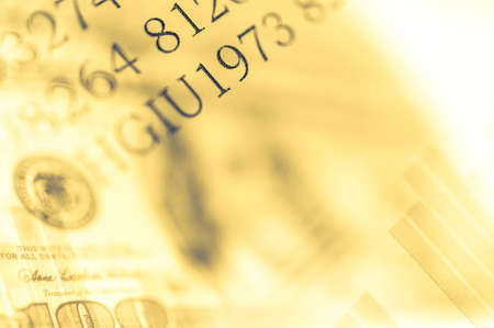 Double exposure Stock market display or forex trading graph and candlestick chart on dollar banknoteの写真素材
