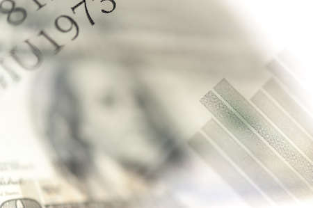 Double exposure Stock market display or forex trading graph and candlestick chart on dollar banknoteの写真素材
